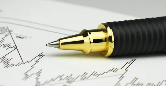 Photo of pen on top of scientific graph.