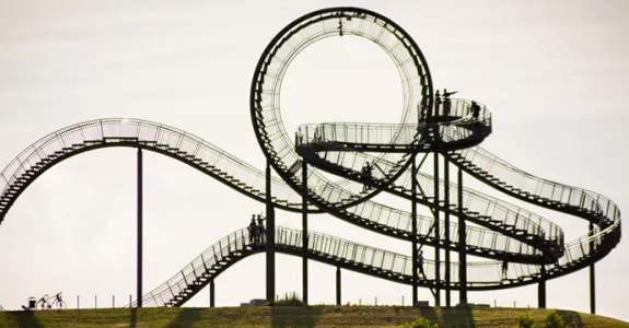 Photo of walkable roller coaster in Germany, with pathways which wrap around themselves and one large full upside-down loop at the top.