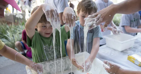 Kids play with cornstarch slurry.