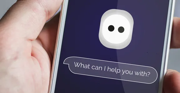 Photo of a hand holding a smartphone with a bubble reading "What can I help you with?"