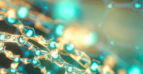 Graphic image showing a glowing gold and teal lattice, against a blurry teal background.