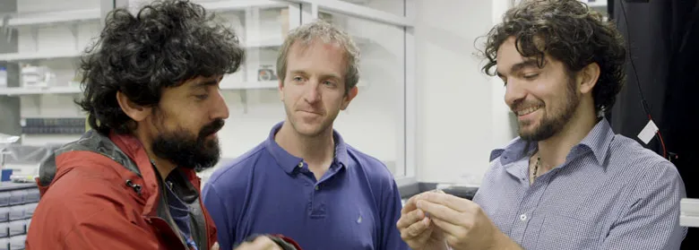 Photo of Dr. Manu Prakash and graduate students Jim Cybulski and Georgios Katsikis.