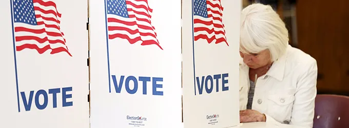 Photo of voter filling out ballot.
