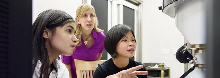 Photo of graduate student Fariah Hayee, Professor Jen Dionne and senior research scientist Ai Leen Koh in the lab.