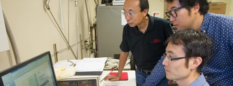 Photo of Professor H.-S. Philip Wong, graduate student Joon Sohn, and postdoctoral fellow Seunghyun Lee.