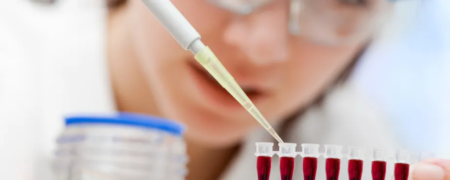 Photo of researcher testing blood samples.