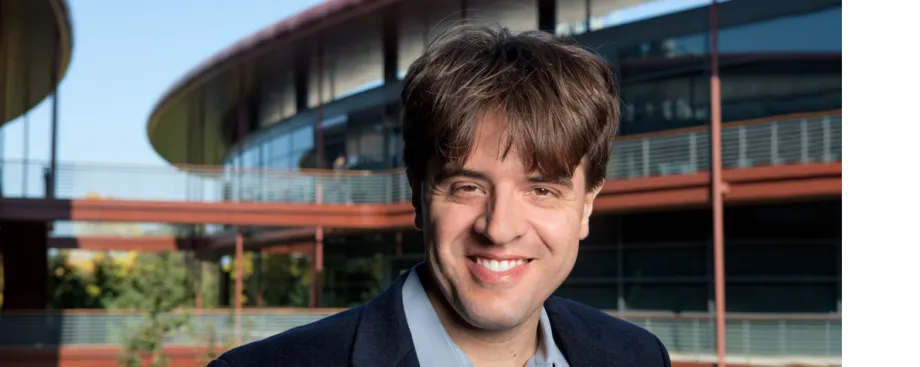 Photo of Dr. Karl Deisseroth standing outside of the Clark Center, home of Stanford Bio-X, at Stanford.
