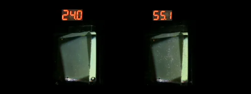 Metal oxide solar cells inside a column of water are producing electrons whose energy is being used to split the hydrogen and oxygen atoms in water.