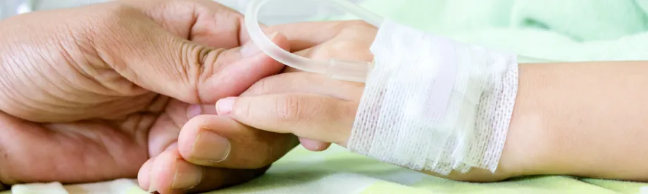 Photo of hand of child in hospital.