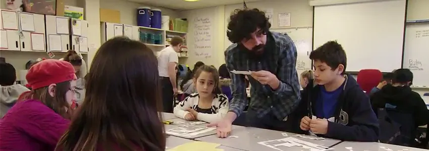 Screenshot from video of Dr. Manu Prakash showing students how to use the Foldscope.