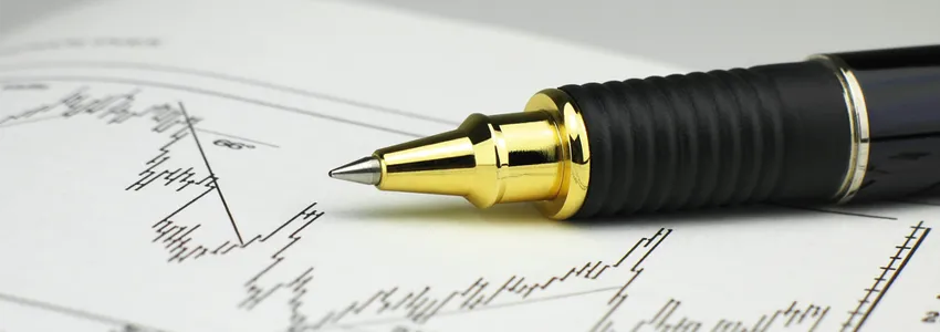 Photo of pen on top of scientific graph.