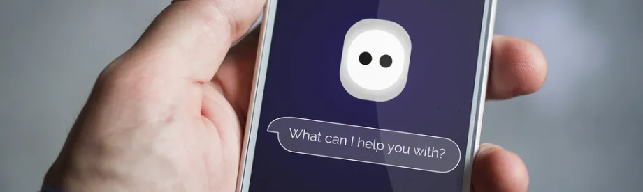 Photo of a hand holding a smartphone with a bubble reading "What can I help you with?"