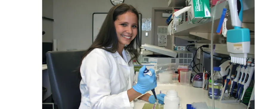 Photo of graduate student Teresa Purzner using a pipette.